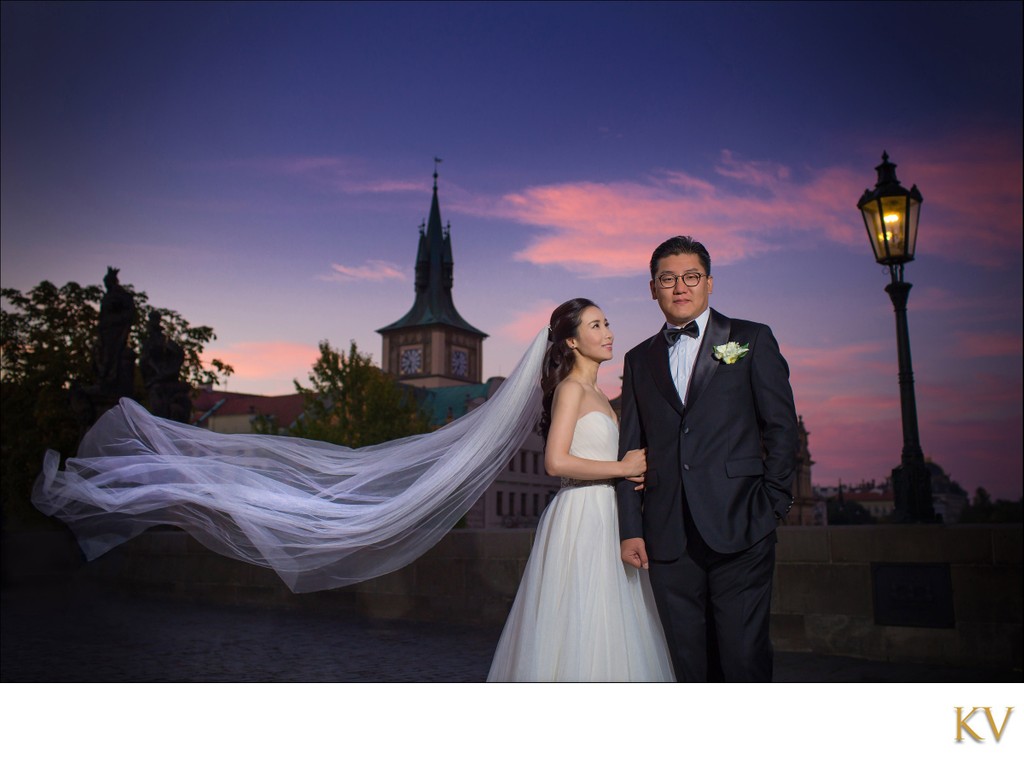 stylish South Korean Newlyweds atop Charles Bridge