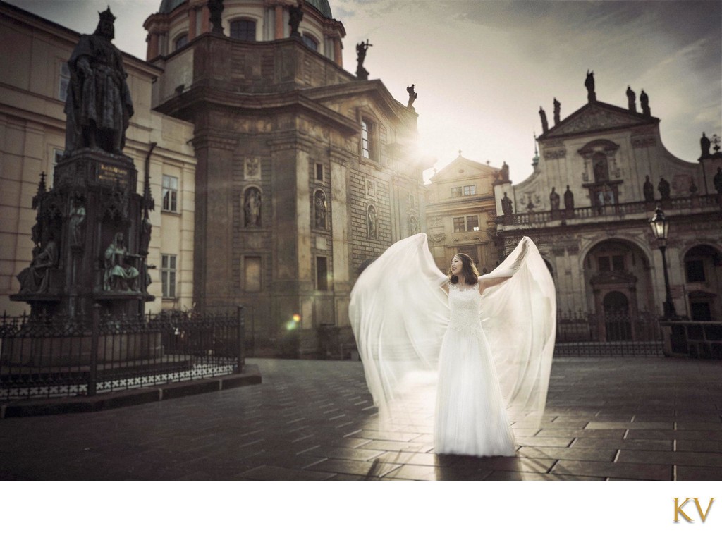 Korean bride posing like an Angel near Charles Bridge