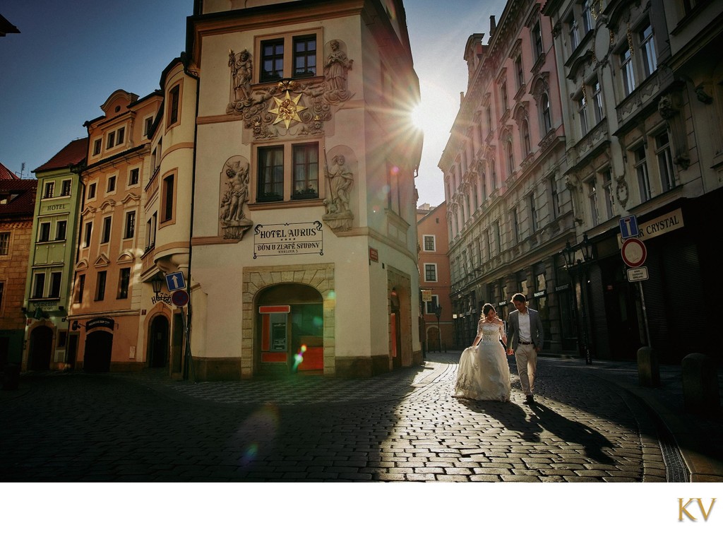 sun flare couple walking in the Old Town