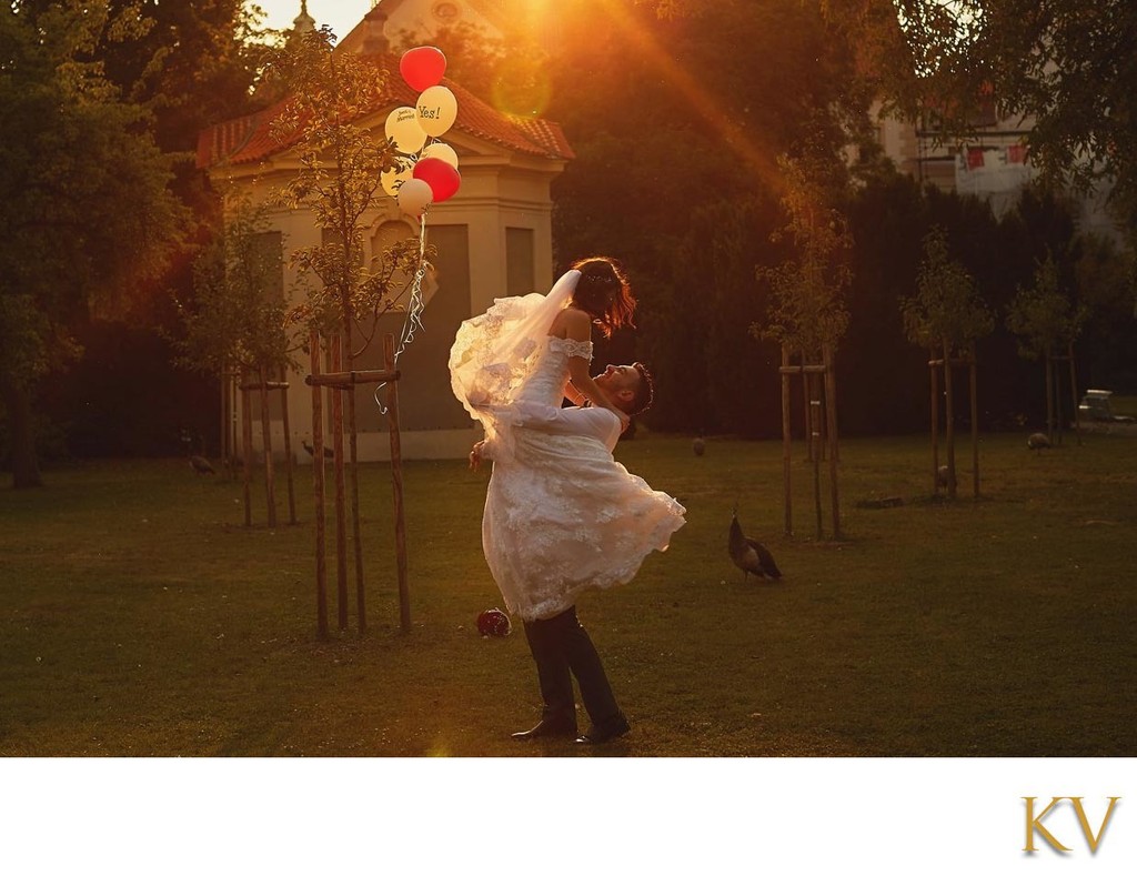 Bride & Groom silhouetted against the sun in Prague's Secret Garden