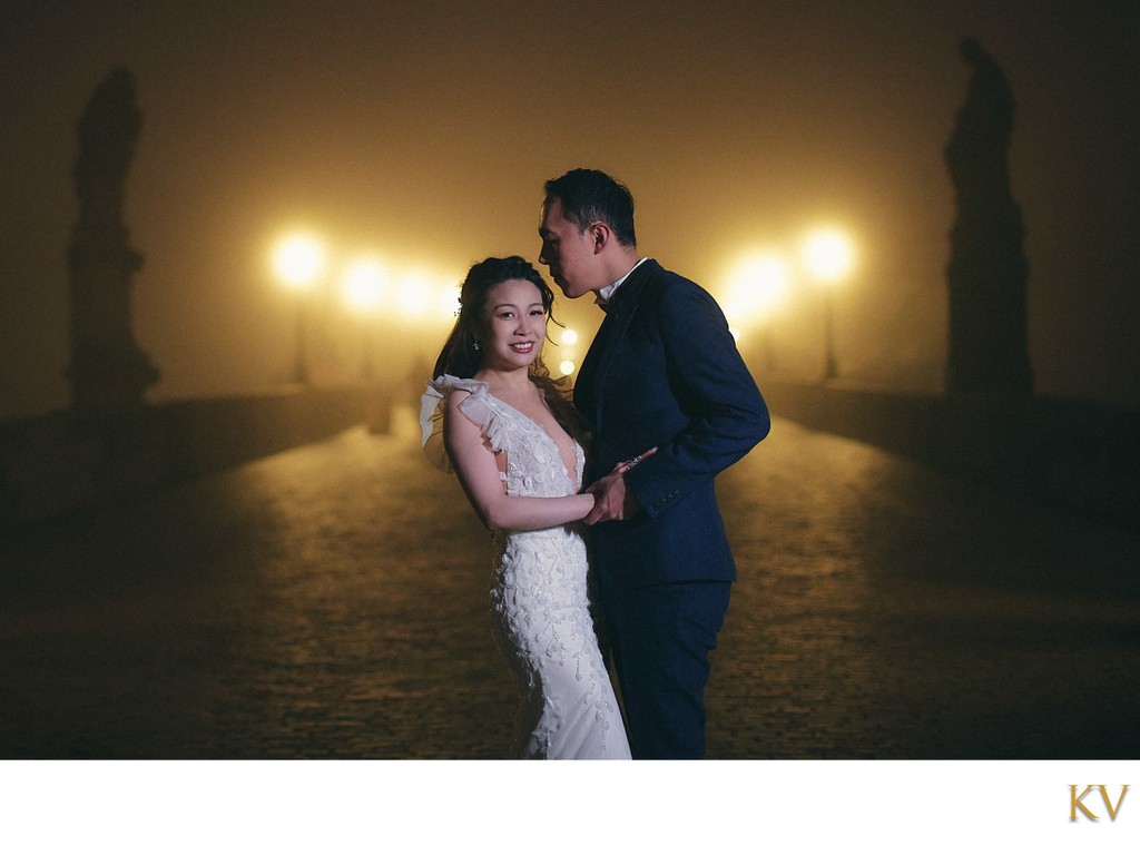 Gorgeous bride & groom on the foggy Charles Bridge