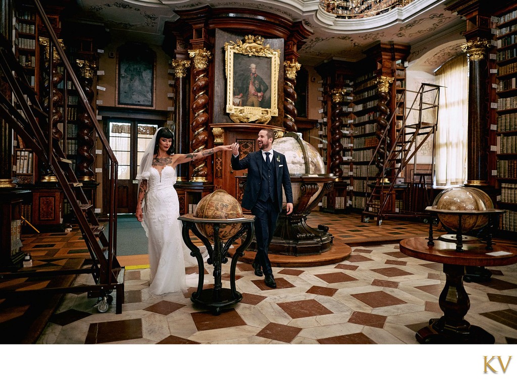 Newlyweds exploring Klementinum Baroque Library 