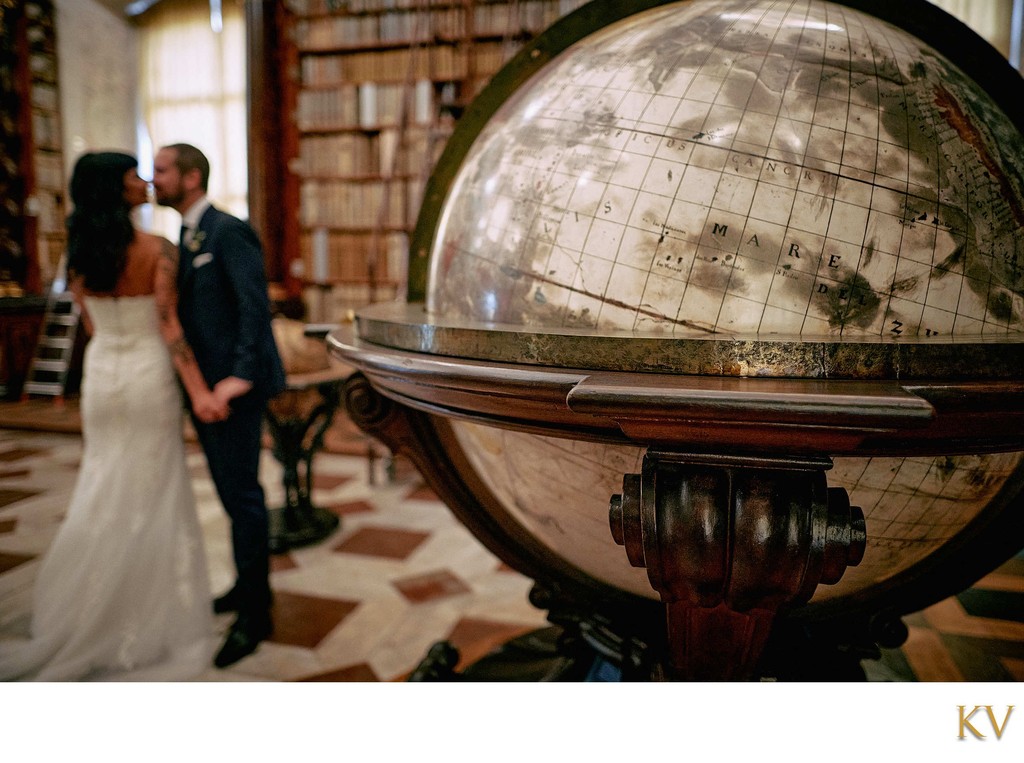 Antique globe and kissing newlyweds.