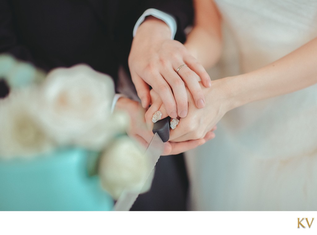 joining hands for cake cutting