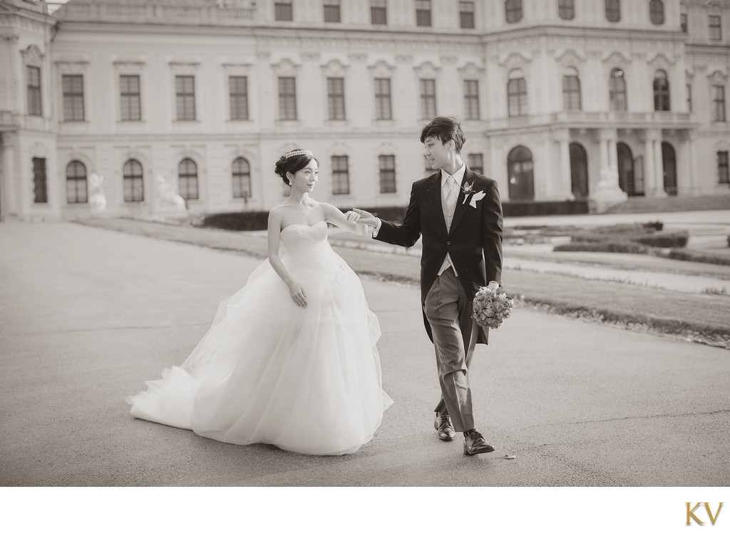 newlyweds walking through garden