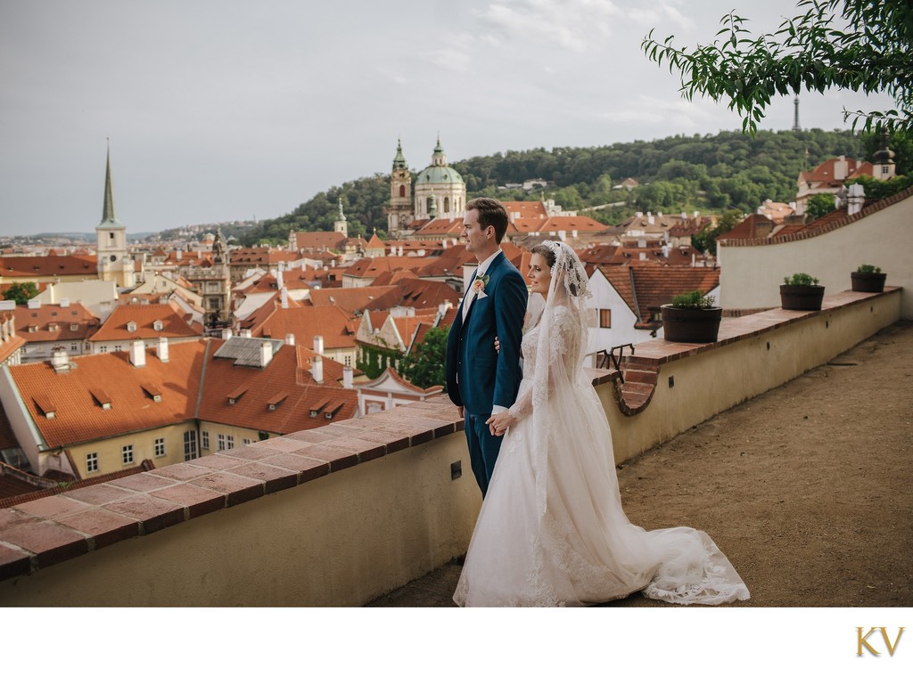 Newlyweds enjoying the scenery high above Prague