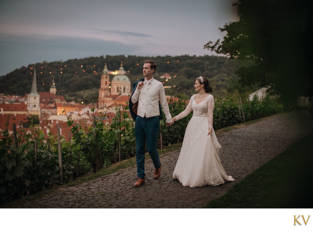 Newlyweds enjoy the view overlooking Prague at dusk