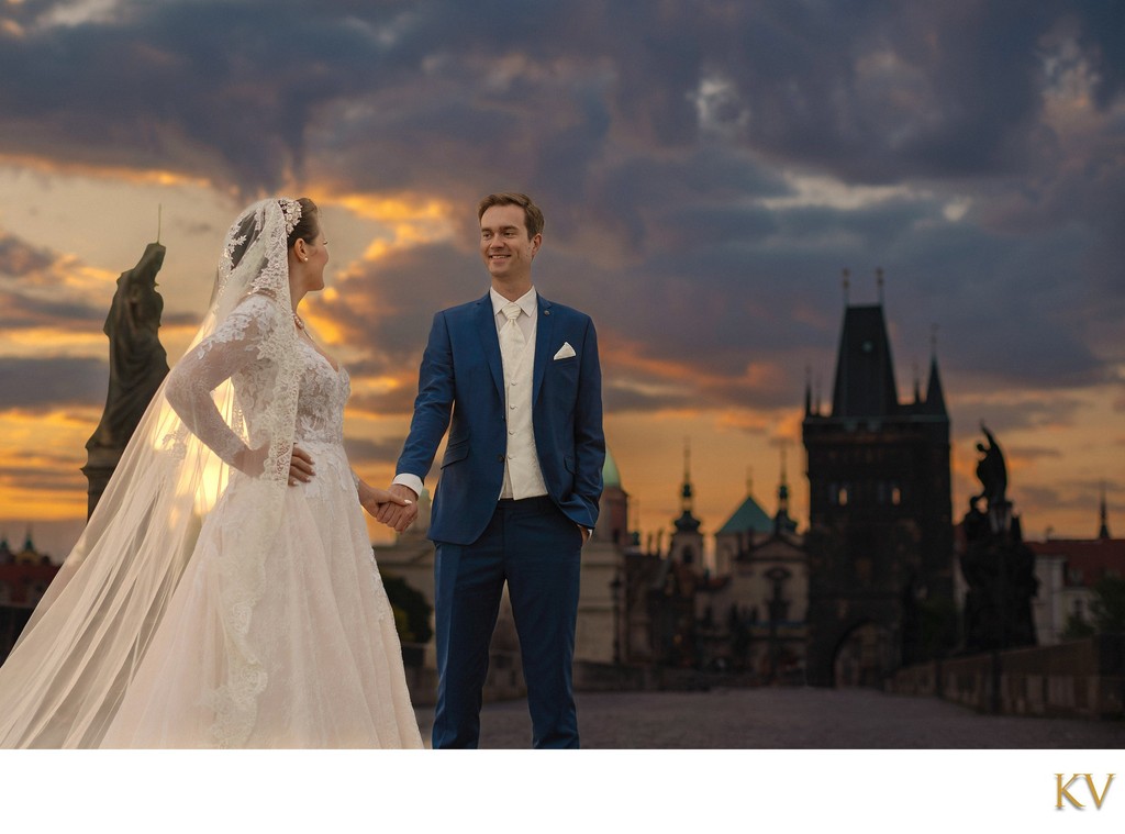 Newlyweds Enjoying the sunrise atop the Charles Bridge