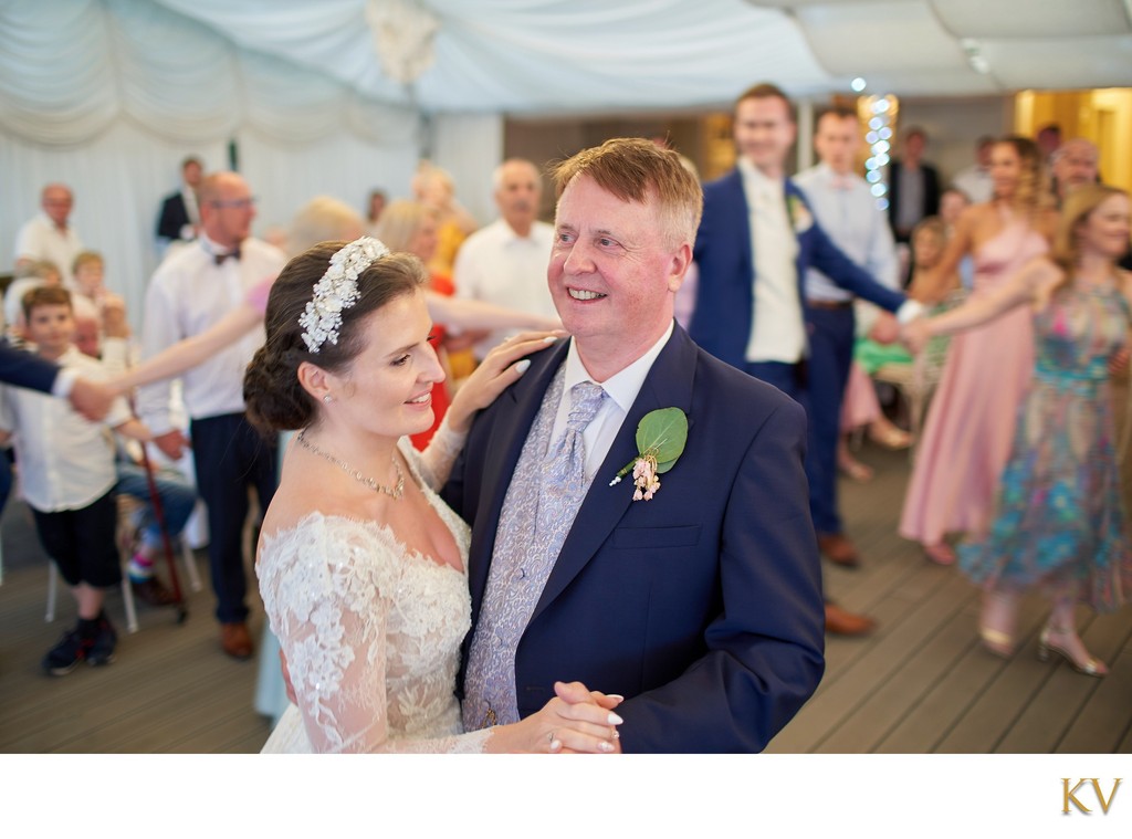 The beaming father and daughter first dance