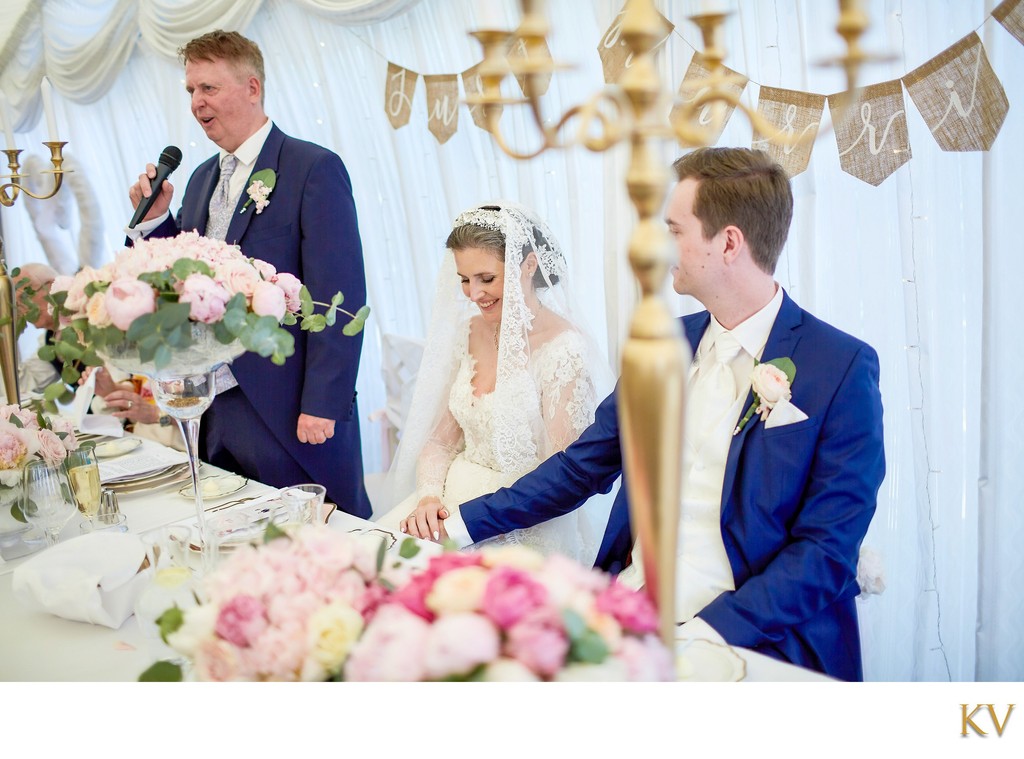 Father speaks as his daughter the bride blushes