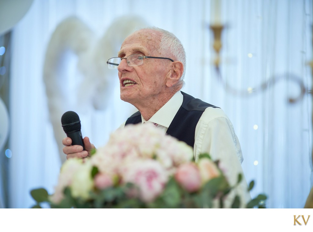 Grandfather toasts newlyweds during Villa Richter celebrations.