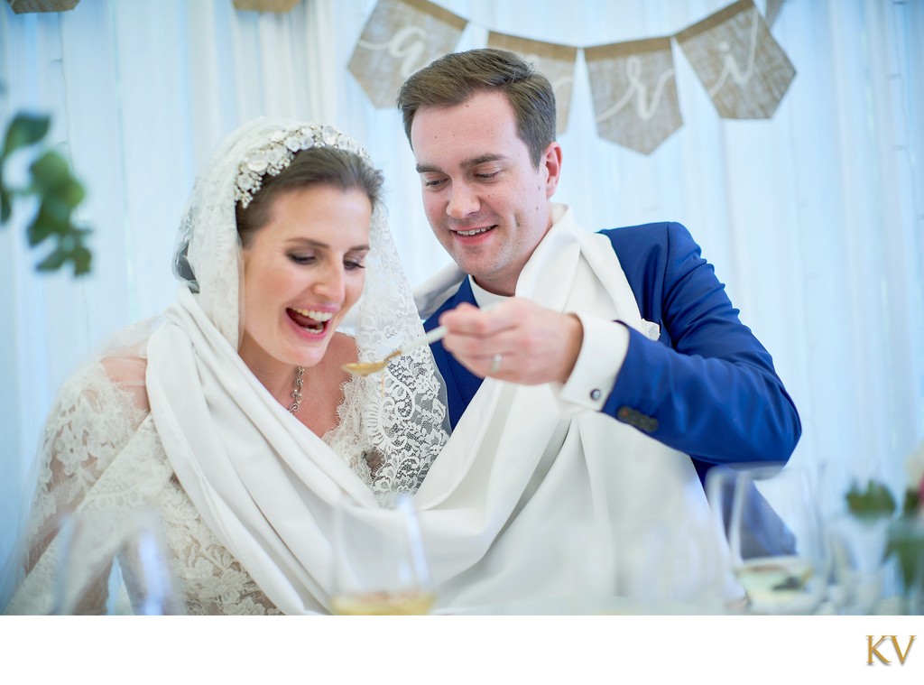 Newlyweds take turns feeding each other soup