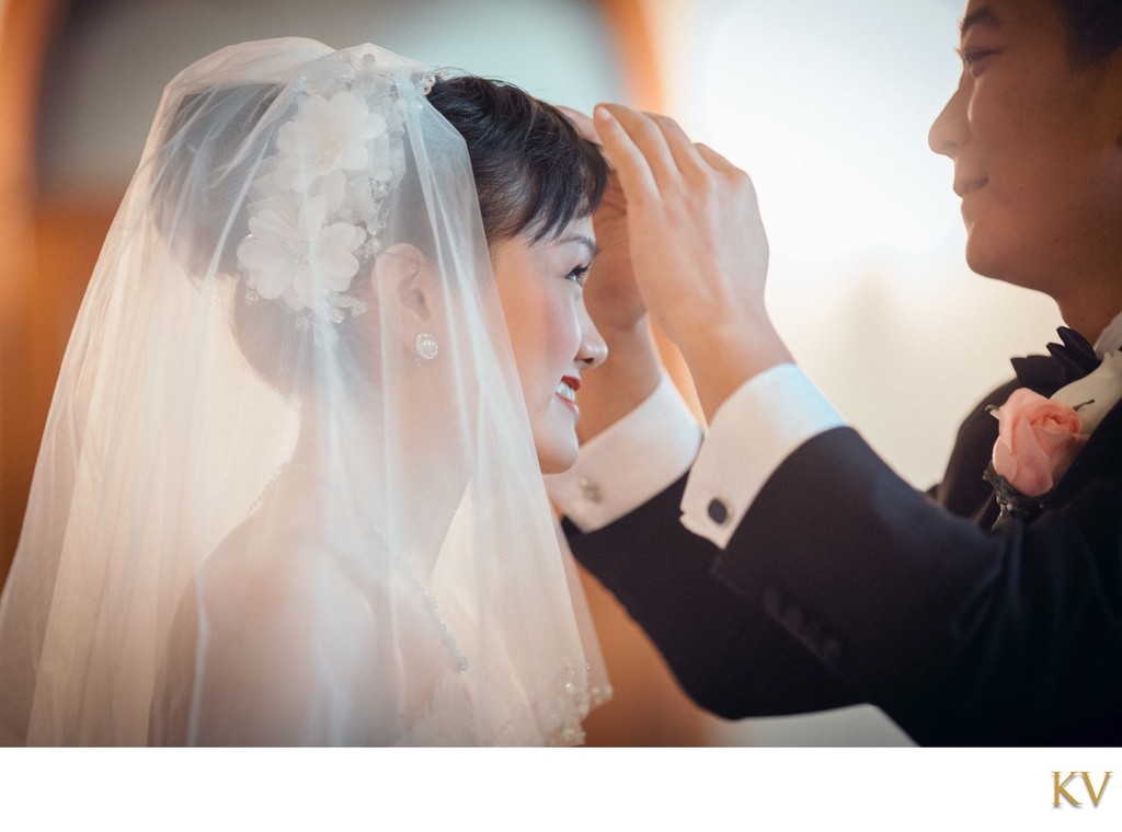 Lovingly Adjusting Bride's Veil Castle Hluboka Wedding