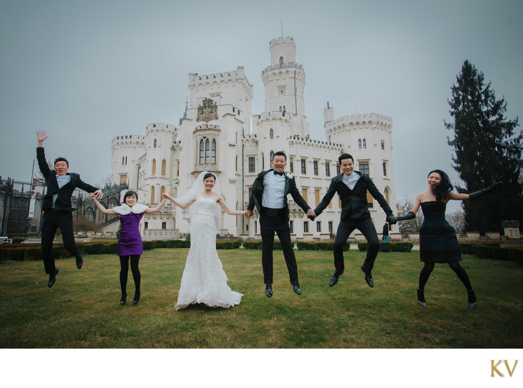 Hong Kong newlyweds and friends jump for joy Castle Hluboka