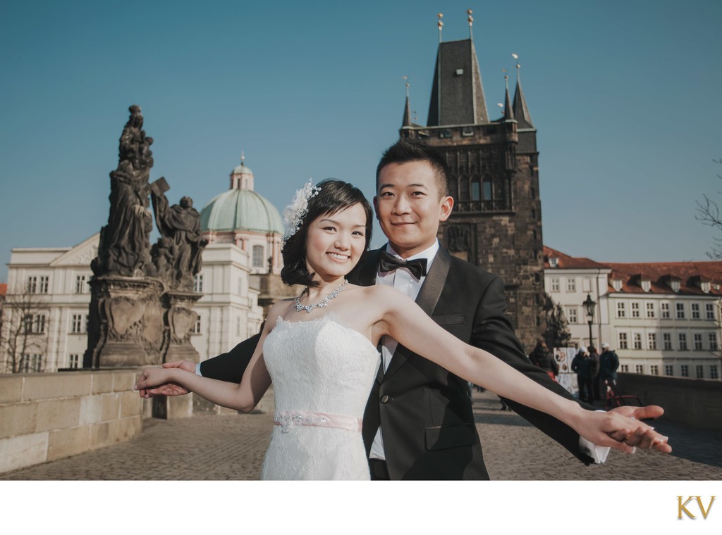 Hong Kong newlyweds Embrace atop Charles Bridge