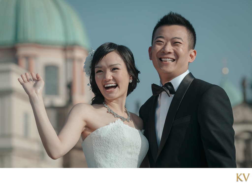 Radiant Hong Kong Newlyweds Waving to admirers in Prague