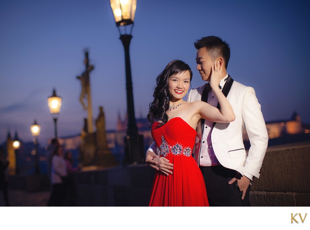 Woman embracing her Hong Kong man atop Charles Bridge