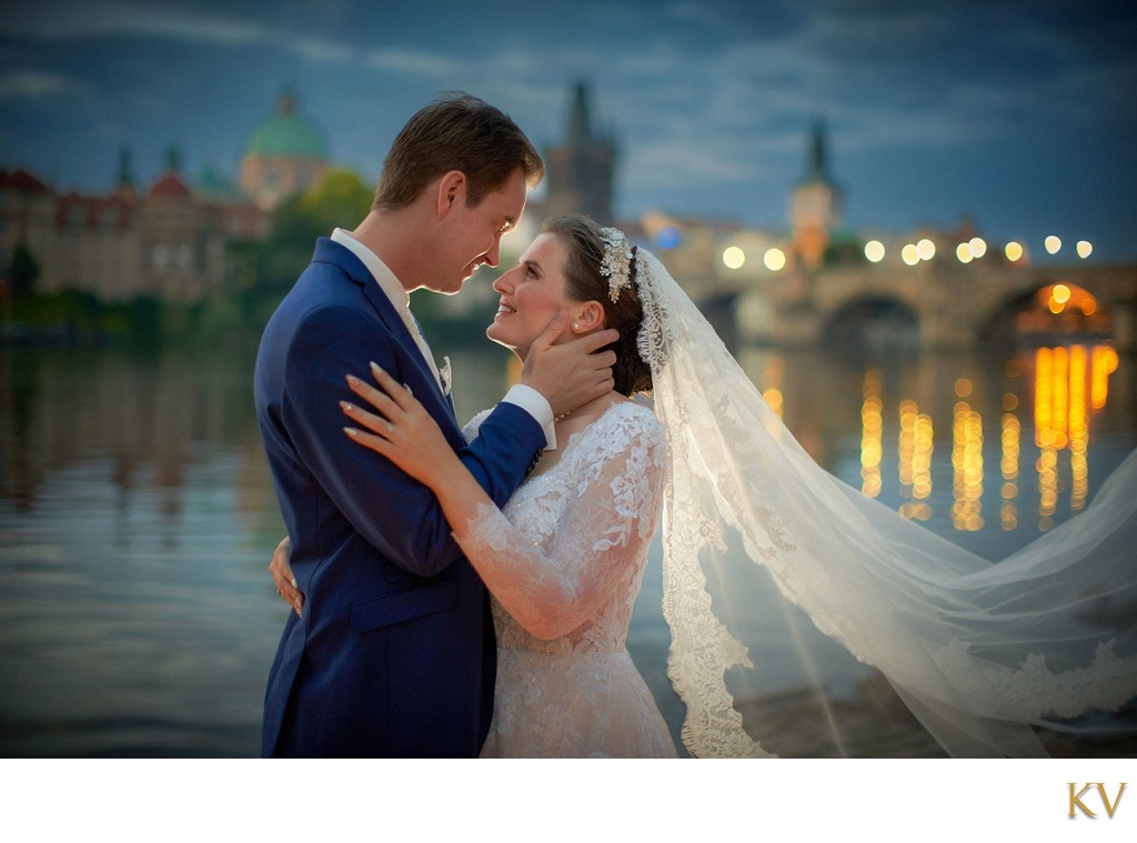 Caressing Bride's Face At Dawn Near Charles Bridge