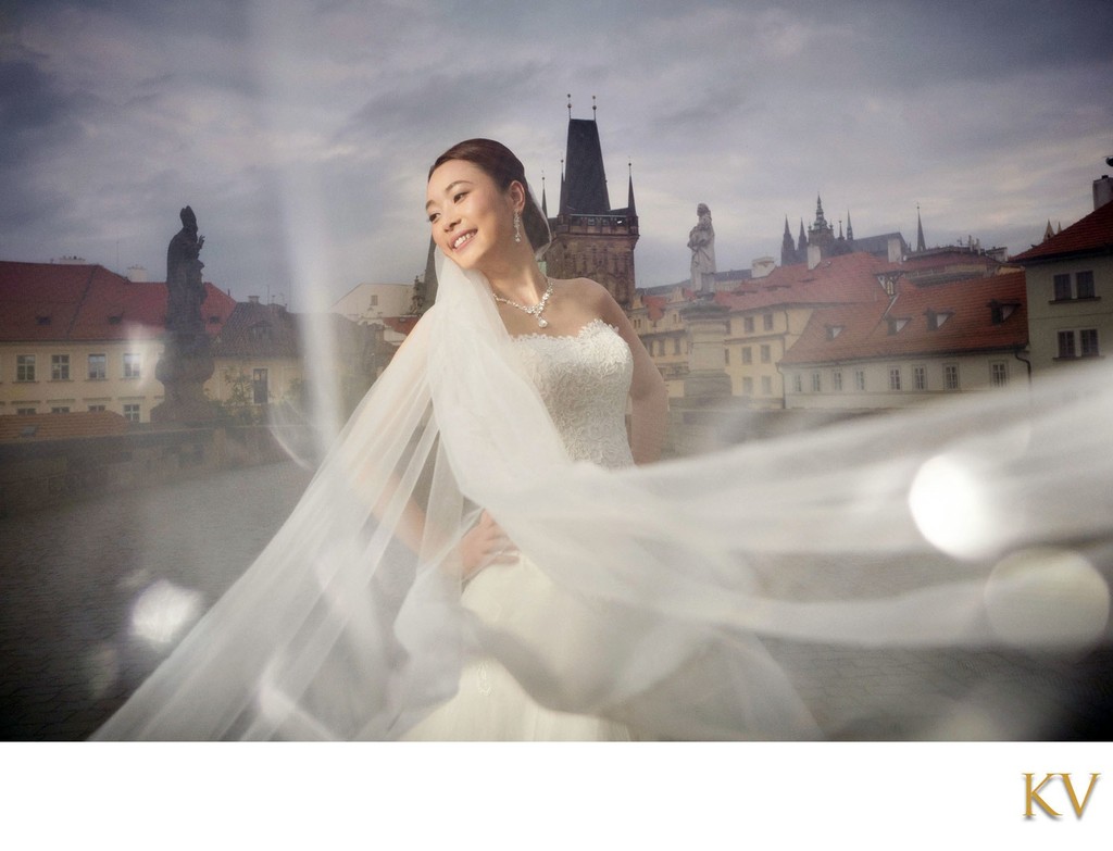 Radiant Bride Posing Atop Charles Bridge At Dawn