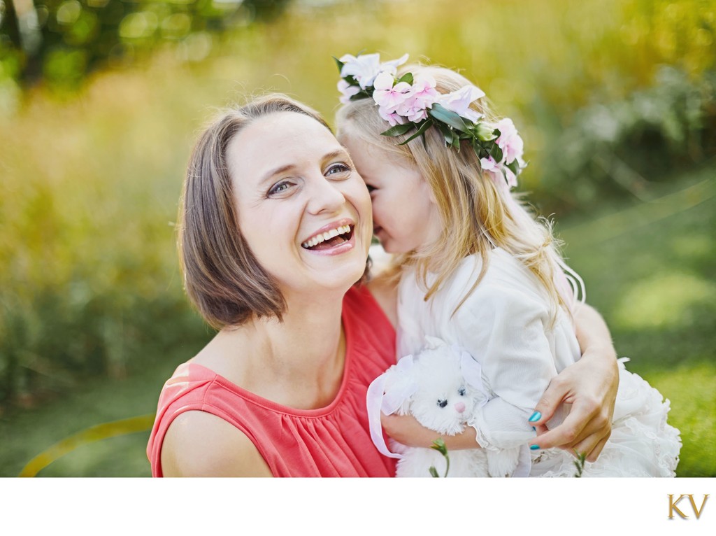 Shy Flower Girl Cuddling Mother