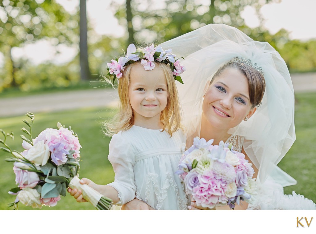 bride and flower girl with their bouquets