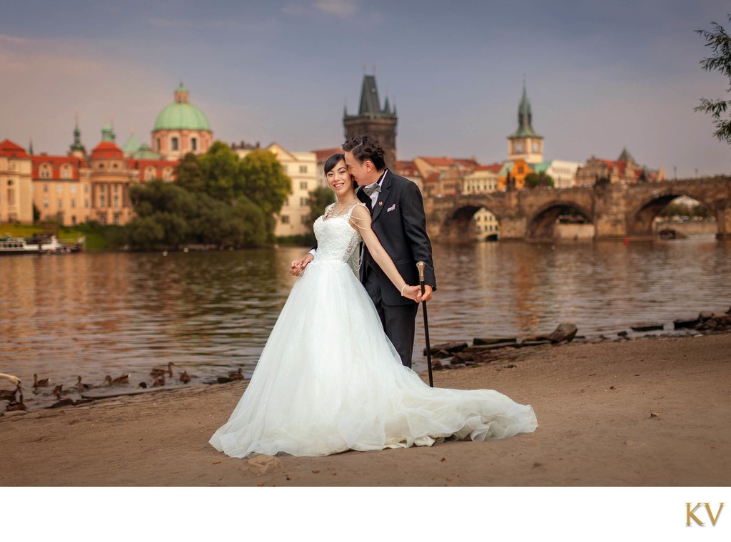 Iconic Riverside and Charles Bridge Couples Photo