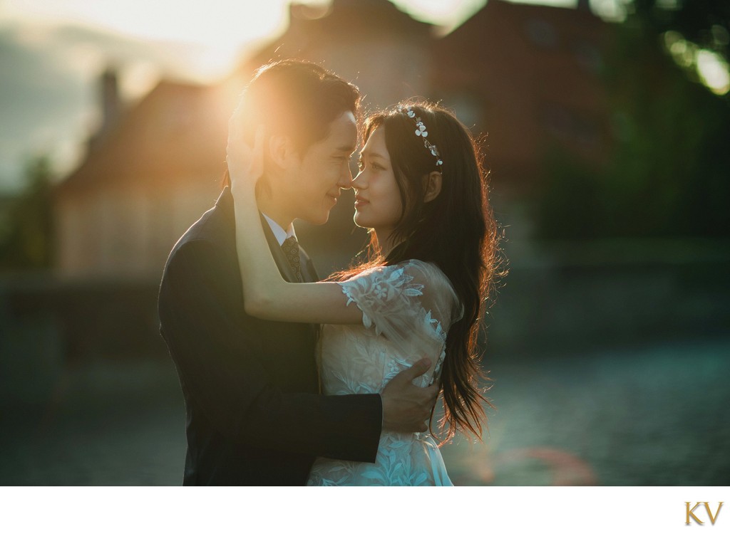 Sun-Flared Embrace atop the Charles Bridge