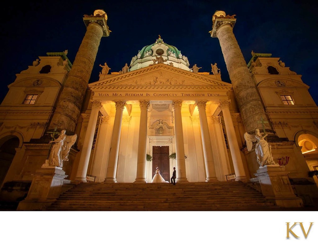 The gorgeous newlyweds posing at the Karlskirche