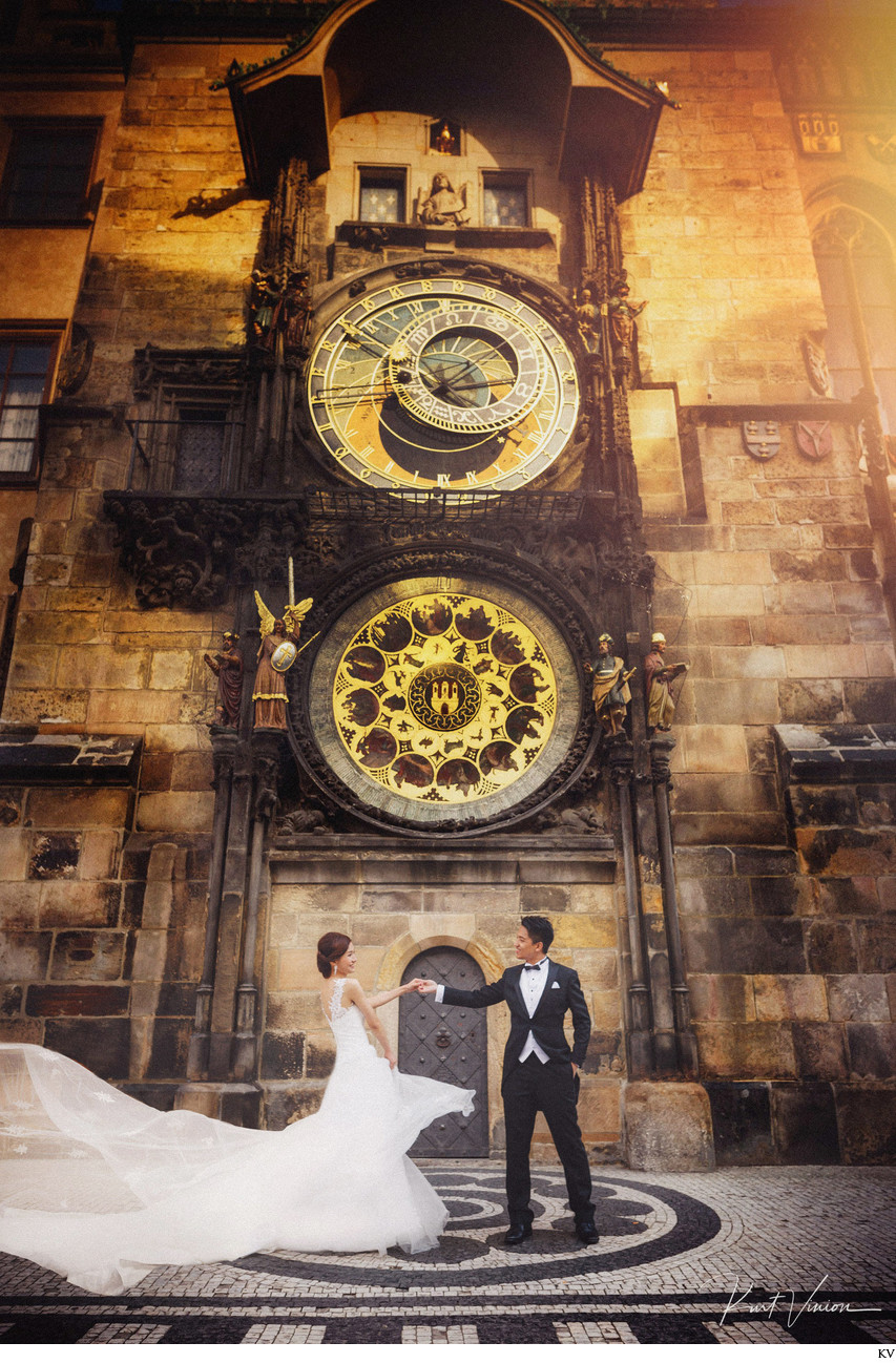 wedded couple dancing under Astronomical Clock
