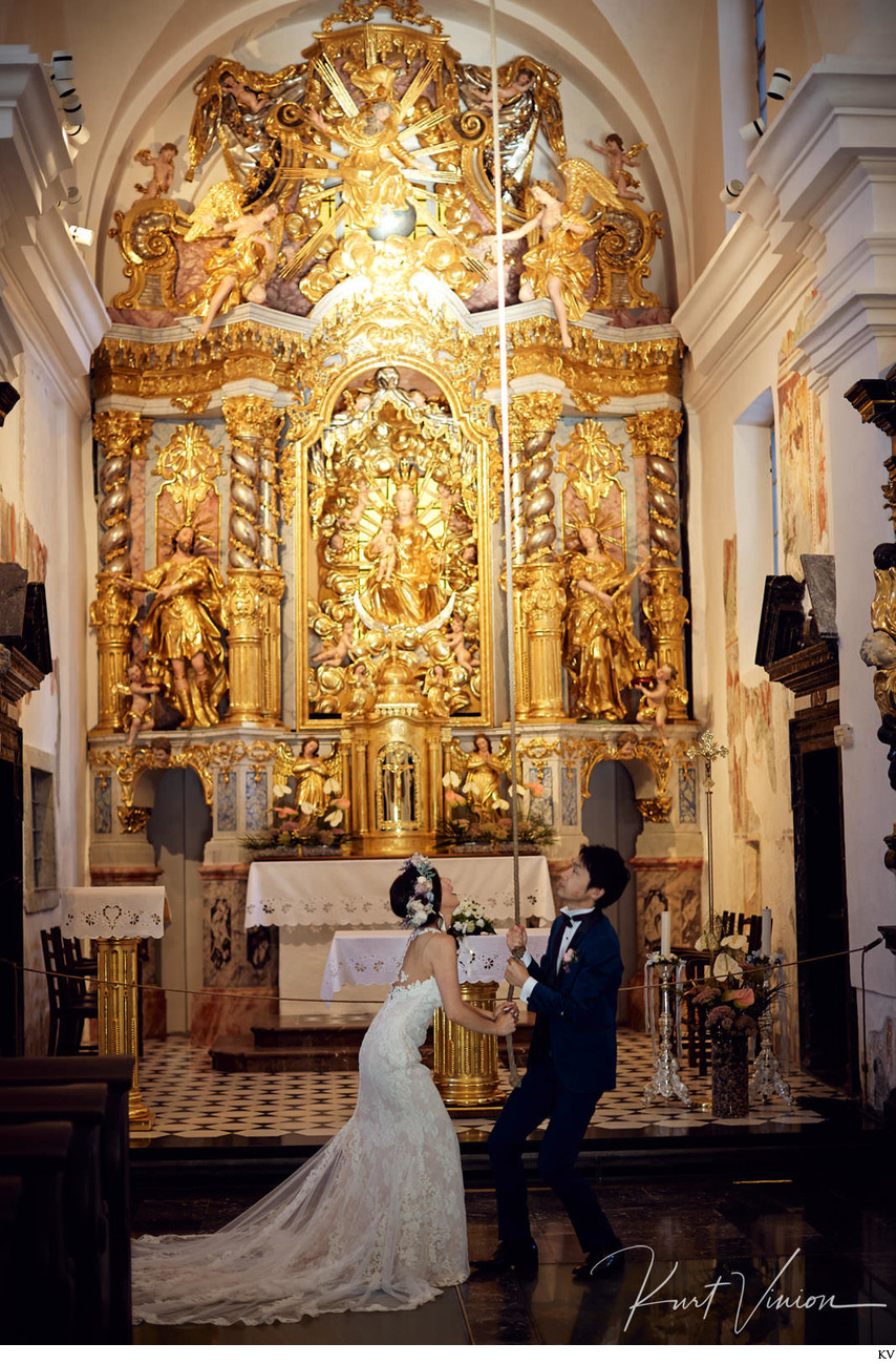 newlyweds ringing the bells 