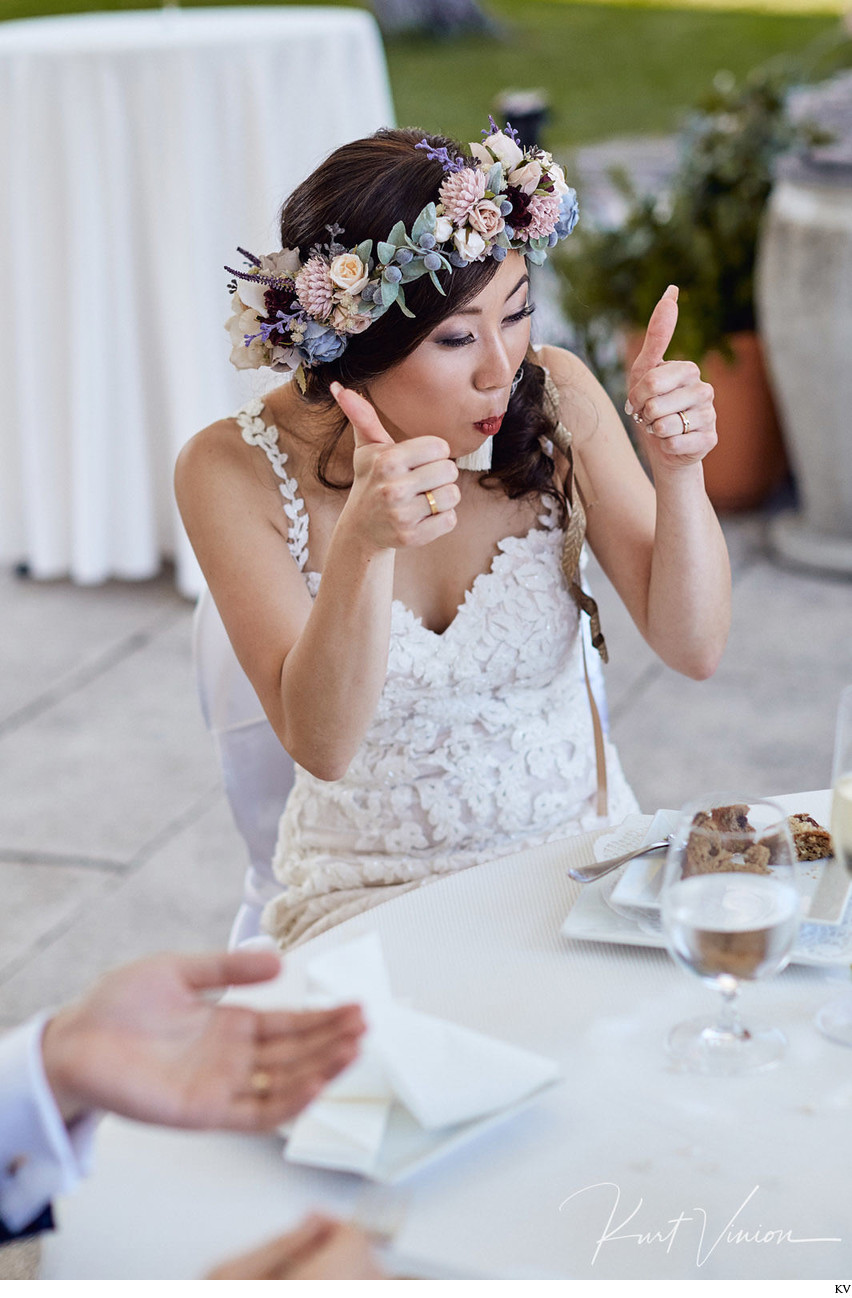 The happy bride enjoying her wedding cake