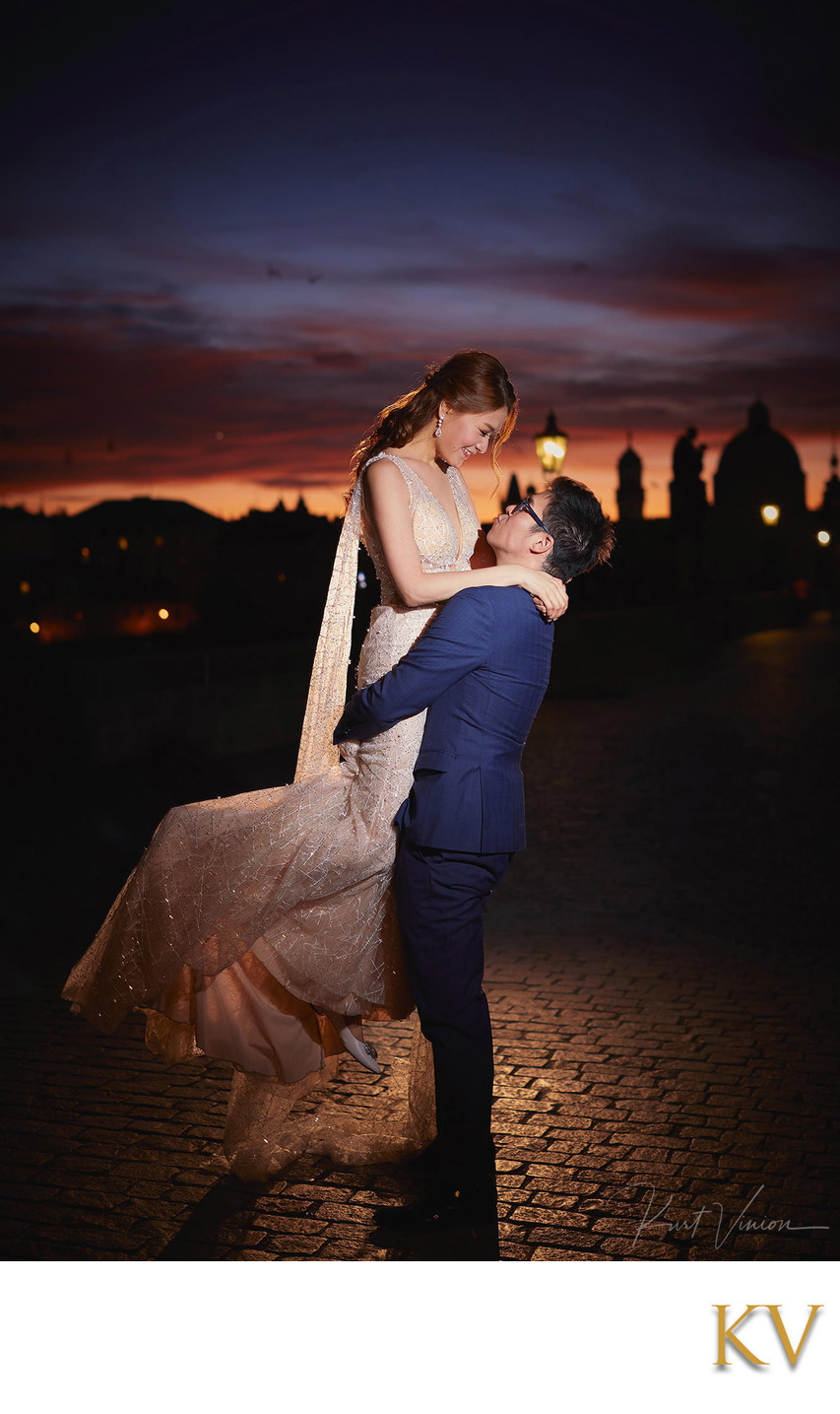 spinning his bride atop Charles Bridge