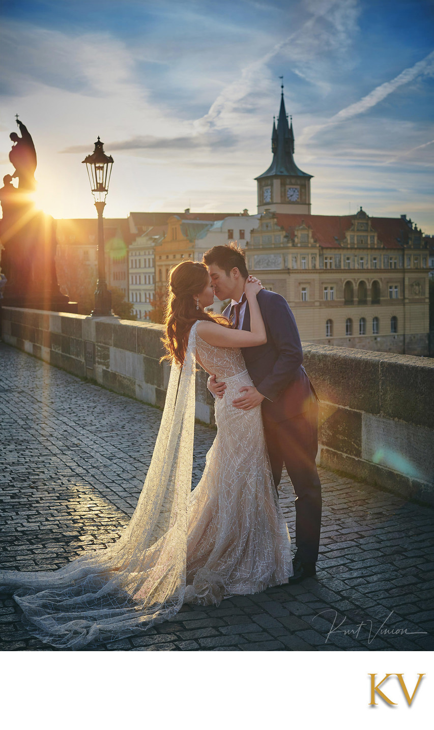 the sun flared kiss atop Charles Bridge