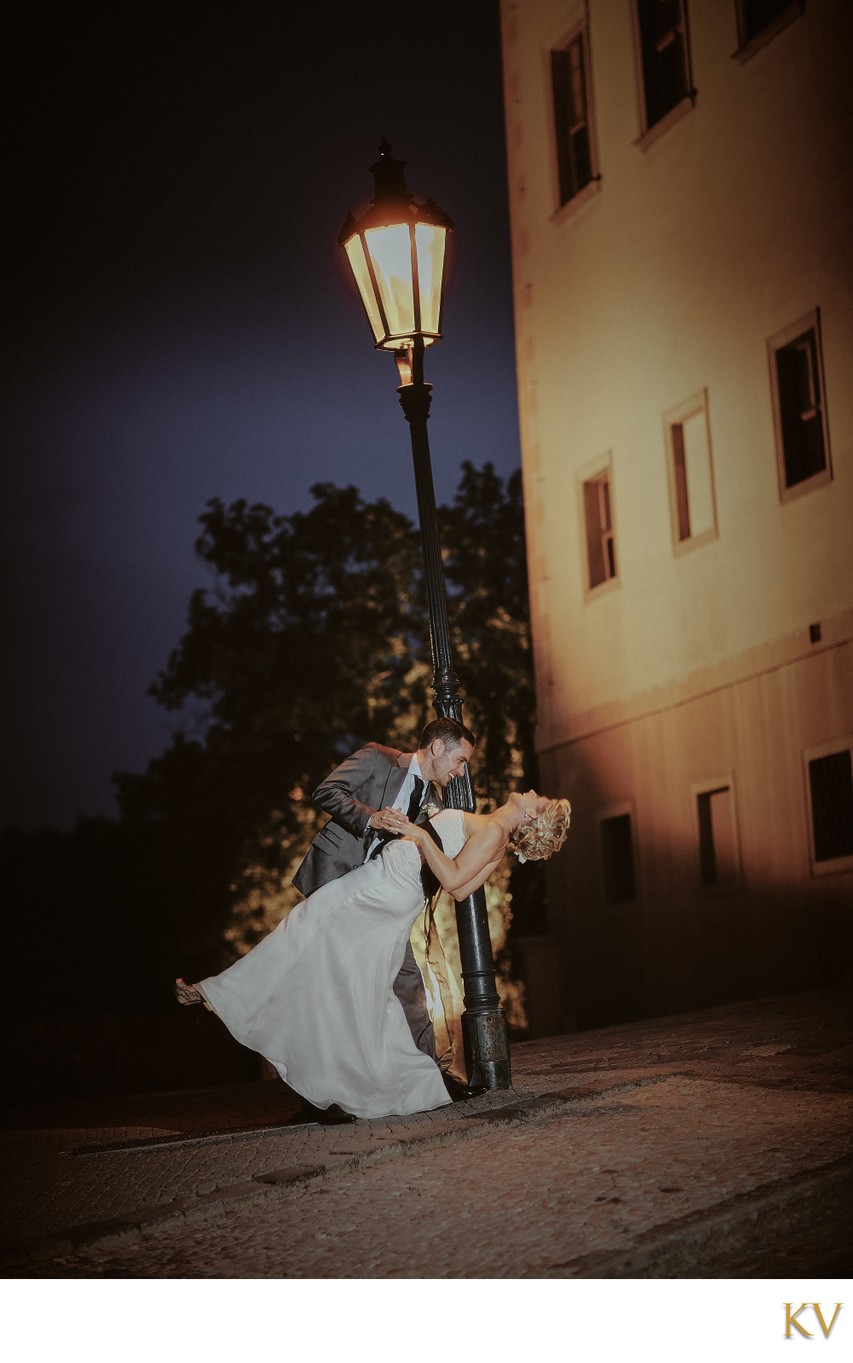 dipping his bride under the gas lamps of Prague Castle