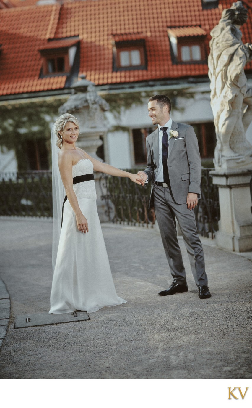 stylish newlyweds strolling through garden