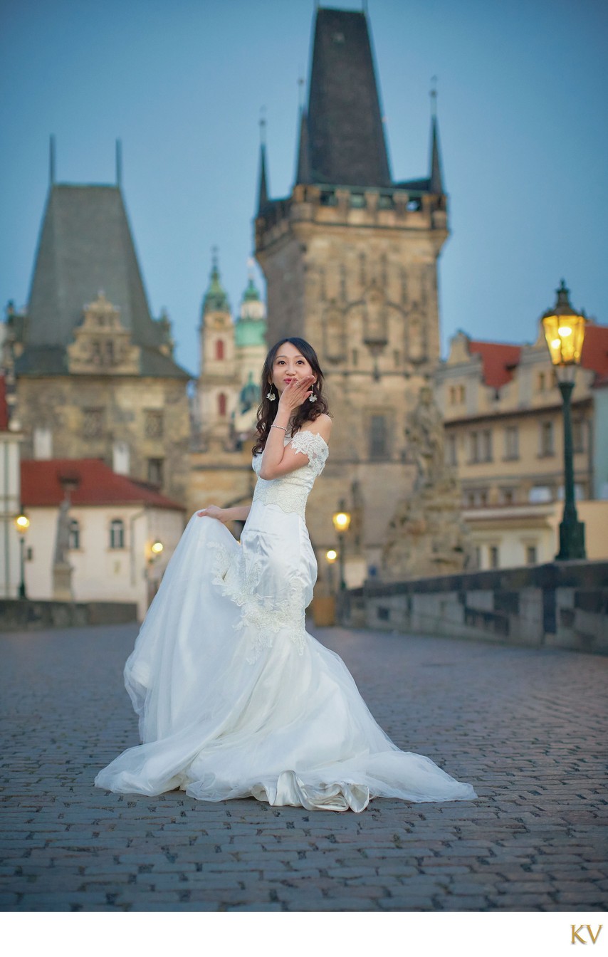 blowing kisses atop Charles Bridge