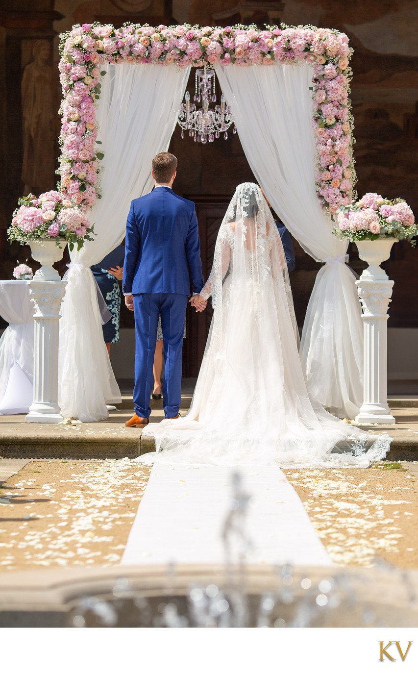 Bride & Groom Under The Floral Arch Ledebour Garden Wedding Prague