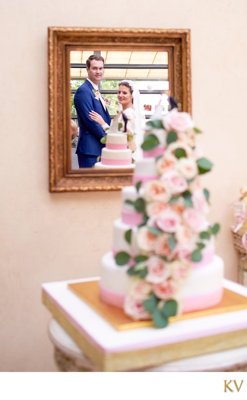 Bride & groom pictured near the wedding cake