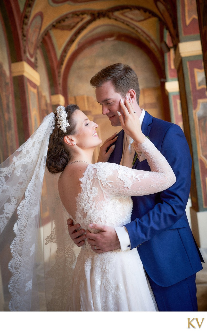 The bride caresses the groom's face Ledbour Garden Wedding