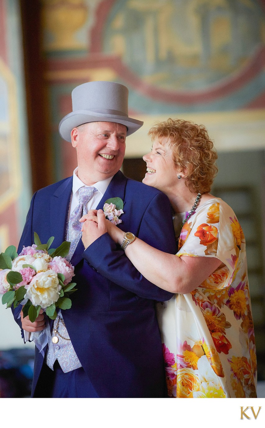 The Beaming Brides Parents Pose For A Wedding Portrait