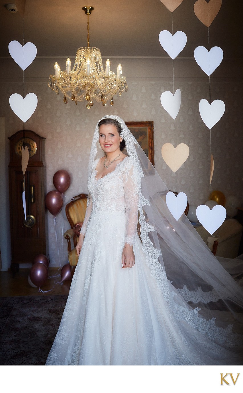 Paper hearts surround the bride on her wedding day in Prague