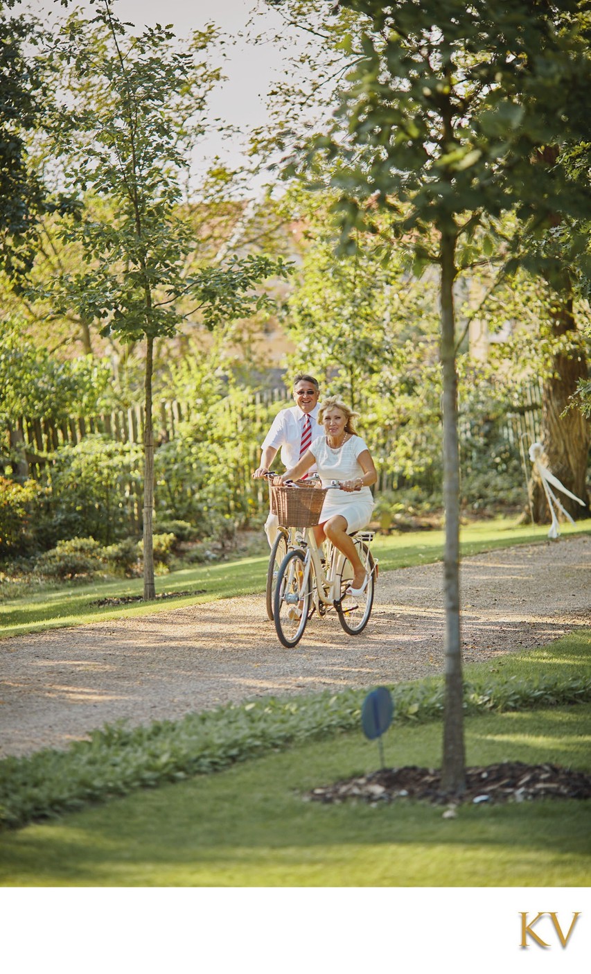 Groom's Parents tour the grounds on bikes