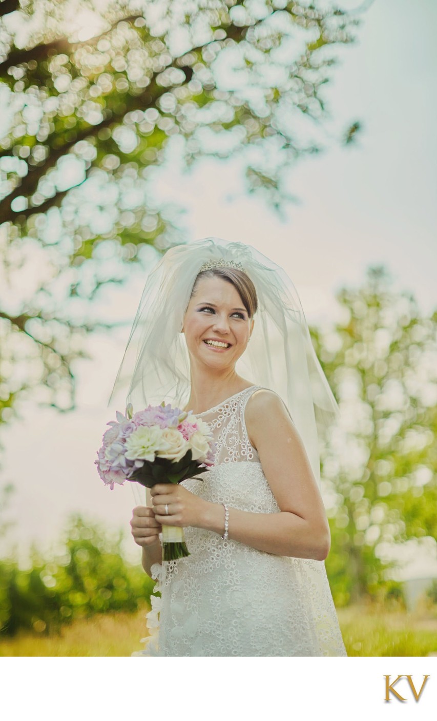 backlit bride holding bouquet