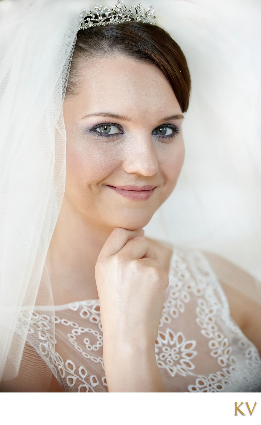 Bride resting chin on hand