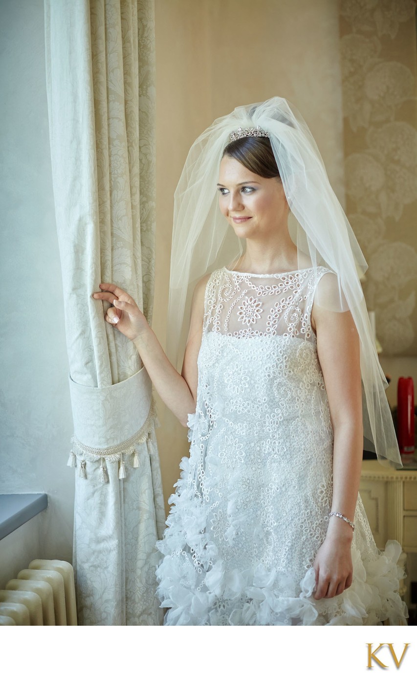 Bride looking out window