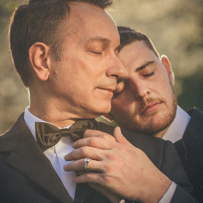 portrait of two men during their engagement session