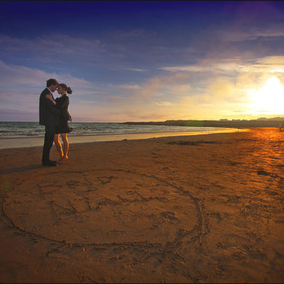 Brid & Nial beach engagement session names in sand