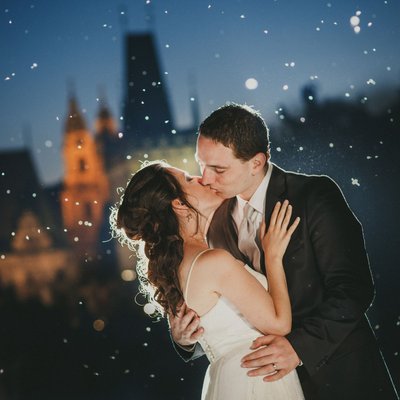 magical kiss of bride & groom Charles Bridge at night