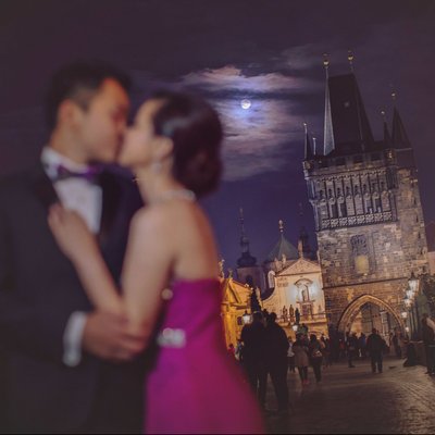 A super moon illuminates lovers on the Charles Bridge