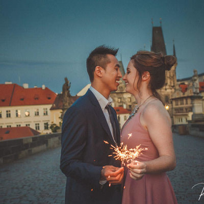 Couple with sparklers Charles Bridge twilight
